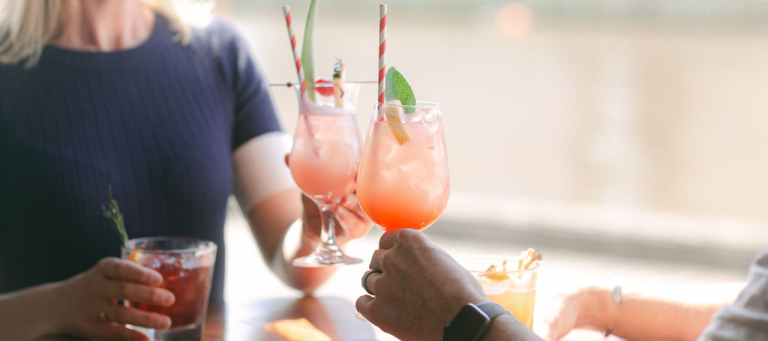 Woman and friend with with a spritz at The General Assembly Venue located at 29 S Wharf Promenade, South Wharf VIC 3006, Australia